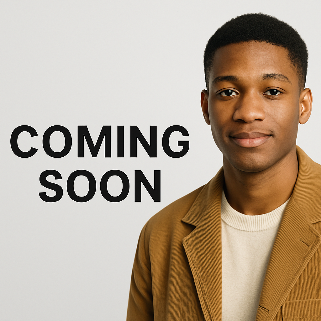 Empty classroom desk with books in front of a chalkboard